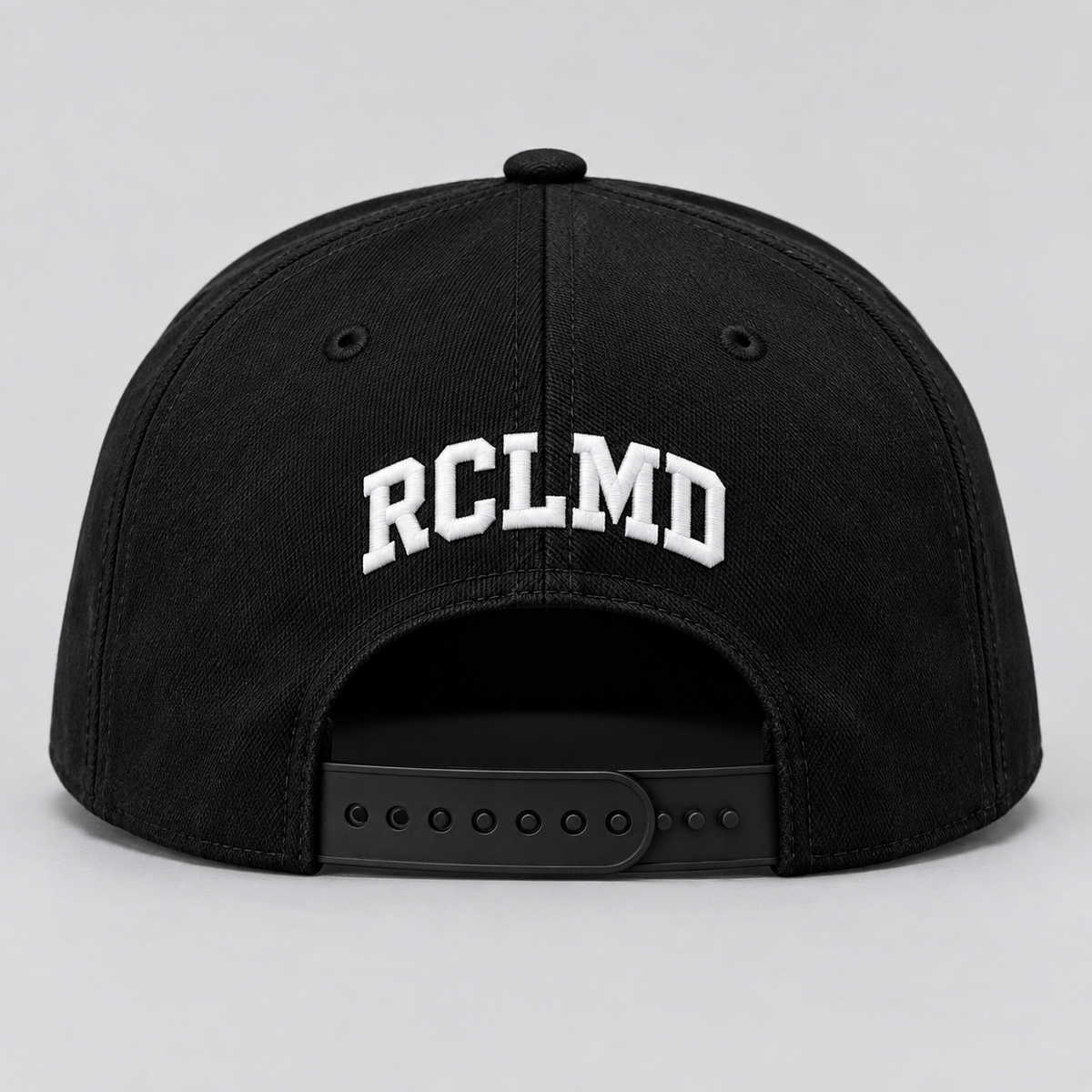 RCLMD snapback in all black, back view with white RCLMD embroidery